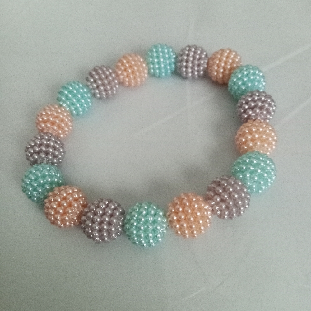 Hand Crafted iridescent pearl pastel beaded statement Bracelet aqua and peach